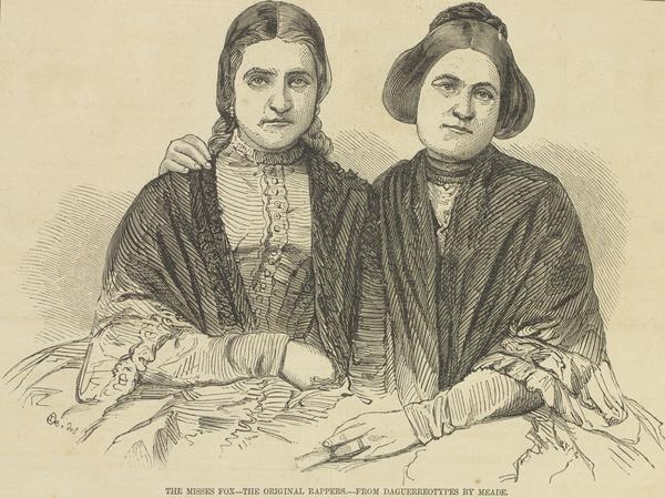 Waist-length portraits of the spiritualists Kate and Margaretta Fox; Margaretta has her arm around Kate.